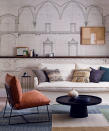 <p> Shallow shelves, painted in the same shade as the walls appear to recede into the background so are ideal for exhibiting art. &#x2018;Floating shelves have a contemporary look,&#x2019; says designer, Emma Sims Hilditch, which creates fitted living room storage.&#xA0; </p> <p> &#x2018;Lighting concealed in the shelving can add focus, drawing attention to the treasures on display.&#x2019;&#xA0; </p> <p> Place small items in storage baskets or boxes that will fit on the shelves. This replaces clutter with points of calm on the shelves to give the eye a place to rest. </p>