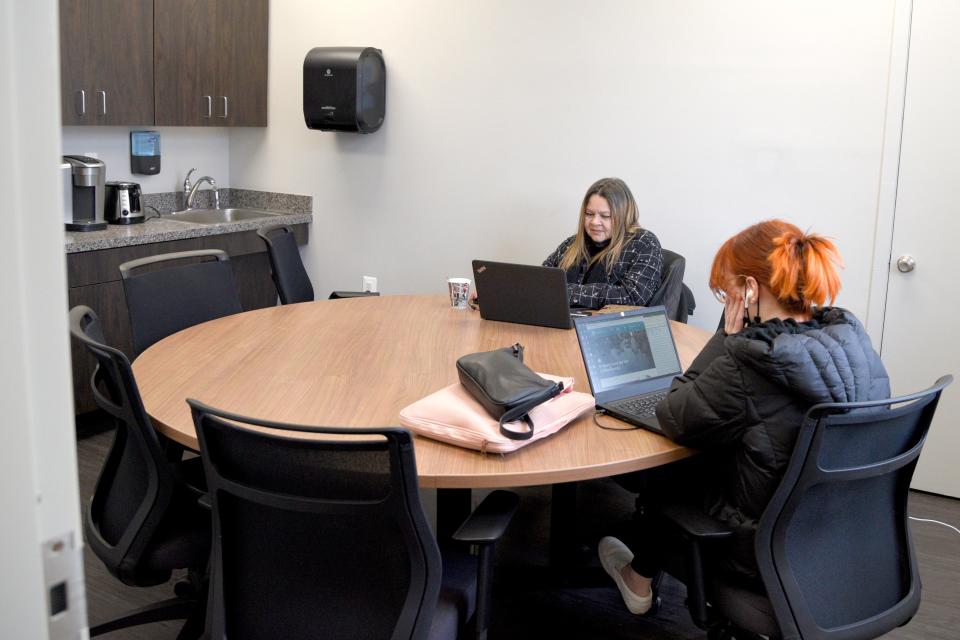 Digna Diaz, Community Outreach Manager, left, and Mildred Rivera, Community Health Outreach Specialist, work in the break room of the newly opened Red Bank Community Health Center on Tuesday, December 27, 2022 in Red Bank, New Jersey.