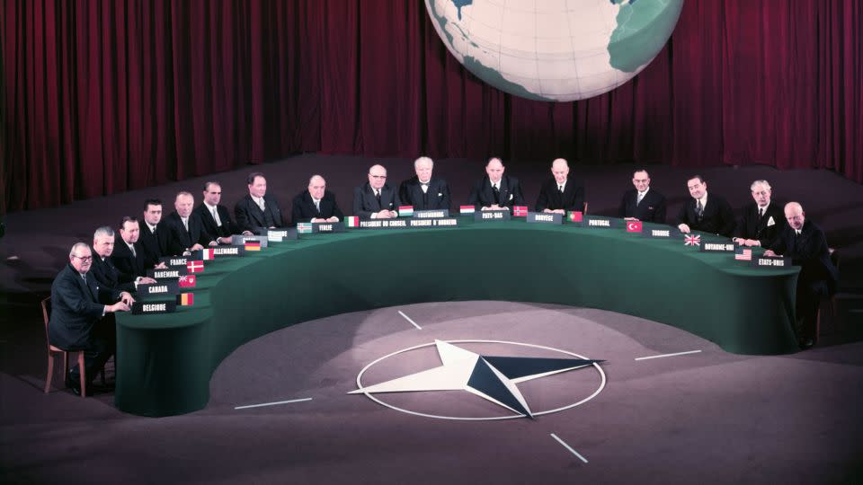 This December 1957 photo shows heads of government, including US President Dwight D. Eisenhower, attending the annual "family portrait" during NATO top-level meetings at the Palais de Chaillot. - Bettmann Archive/Getty Images