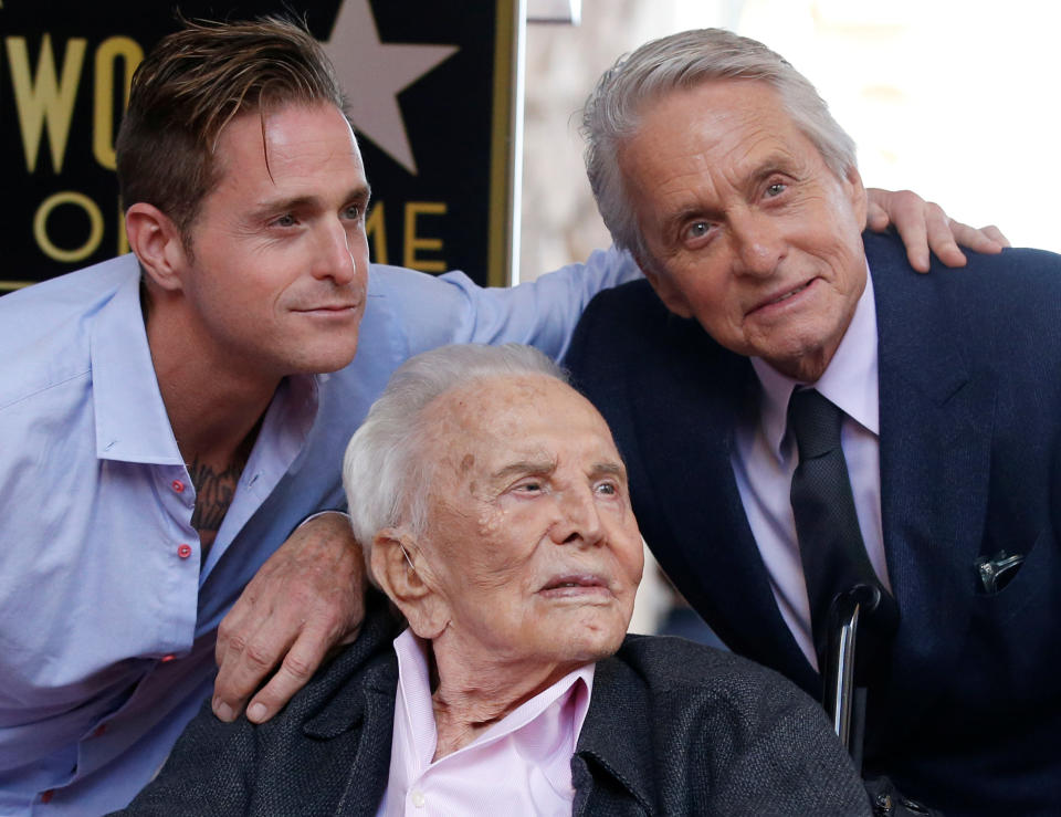 Actor Michael Douglas poses with his father Kirk Douglas and son Cameron Douglas during the unveiling of his star on the Hollywood Walk of Fame in Los Angeles, California, U.S., November 6, 2018. REUTERS/Mario Anzuoni