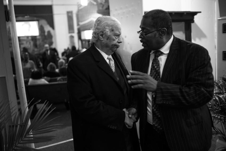 <p>Spencer Leak Sr speaks to an attendee at a funeral, his sixth of the day, at Union Tabernacle Missionary Baptist Church on Chicago’s south side. (Photo: Jon Lowenstein/NOOR for Yahoo News) </p>