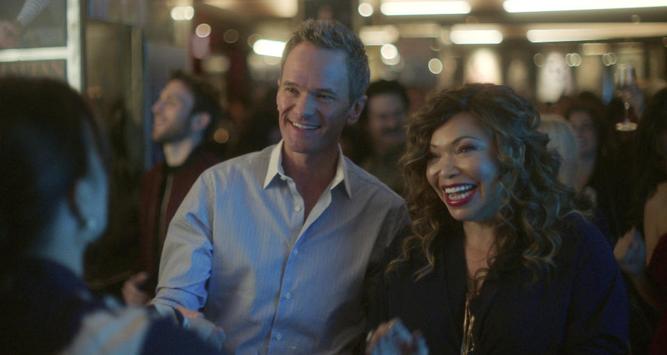 This image released by Netflix shows Neil Patrick Harris as Michael Lawson and Tisha Campbell as Suzanne Prentiss, right, in a scene from "Uncoupled." (Barbara Nitke/Netflix via AP)