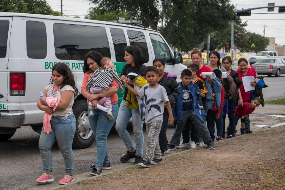 Central American migrant families arrive at a Catholic Charities respite center after being released from federal detention in McAllen, Texas.