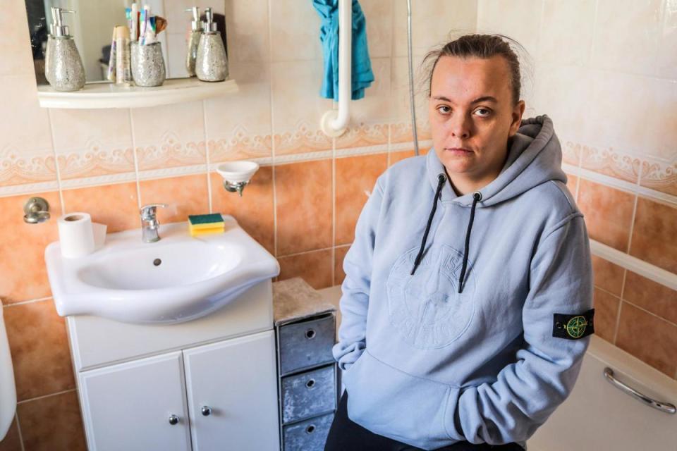 Aisha Elsey-Bennett in her leaky bathroom at her rented home in Blackhall Colliery. <i>(Image: STUART BOULTON)</i>