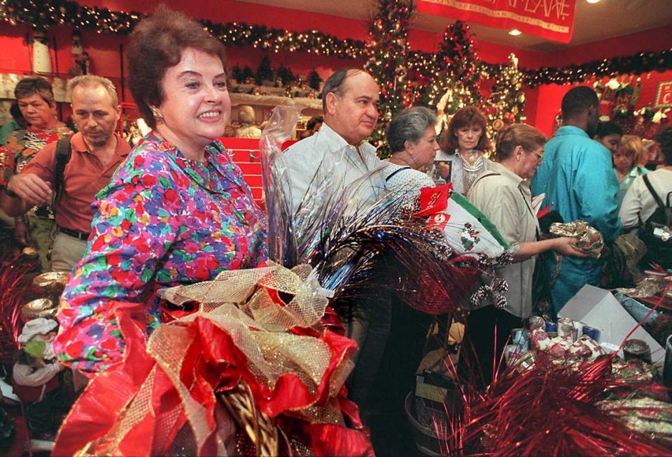 In this file photo from Dec. 26, 1996, Broward resident Jean Peele (left) stood in long lines at Aventura’s Macy’s store in North Miami-Dade as customers filled the store looking for post-holiday bargains or exchanges or refunds.