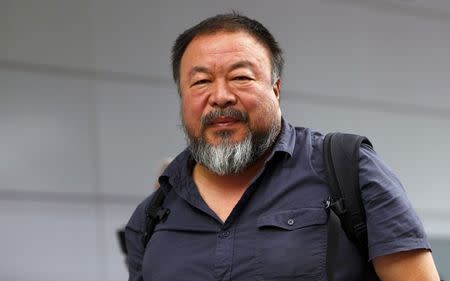 Dissident Chinese artist Ai Weiwei leaves the airport in Munich, Germany July 30, 2015. REUTERS/Michaela Rehle