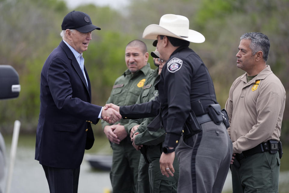 FILE - President Joe Biden talks with the U.S. Border Patrol and local officials, as he looks over the southern border, Feb. 29, 2024, in Brownsville, Texas, along the Rio Grande. Over the course of two weeks, President Joe Biden has imposed significant restrictions on immigrants seeking asylum in the U.S. and then offered potential citizenship to hundreds of thousands of people without legal status already living in the country. The two actions in tandem gives the president a chance to address one of the biggest vulnerabilities for his reelection campaign. (AP Photo/Evan Vucci, File)