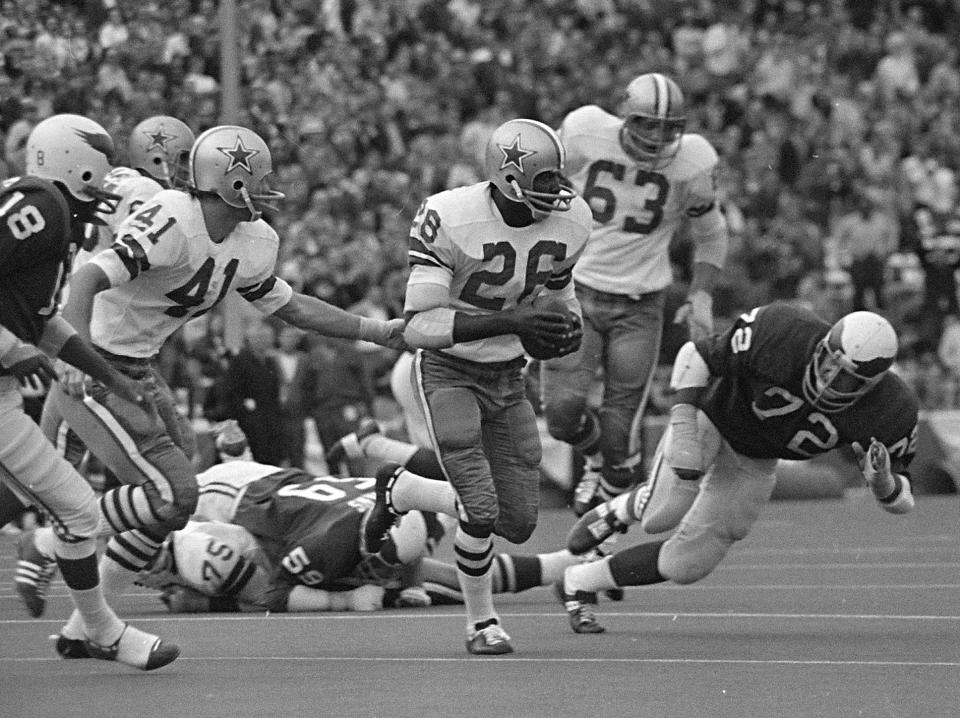 File- This Nov. 1, 1970 file photo shows Dallas Cowboys cornerback Herb Adderley (26) running after intercepting a Philadelphia Eagles pass in the fourth quarter of an NFL game in Dallas, Texas. Tom Brady will soon slip on his sixth Super Bowl ring, and Herb Adderley is the only other man on the planet who can relate to that level of success as the National Football League celebrates its 100th season. "It's going to be a long time, another 100 years, before somebody wins himself six titles," said Adderley, the Hall of Fame cornerback for Vince Lombardi’s great Green Bay Packers teams of the 1960s. (AP Photo/File)