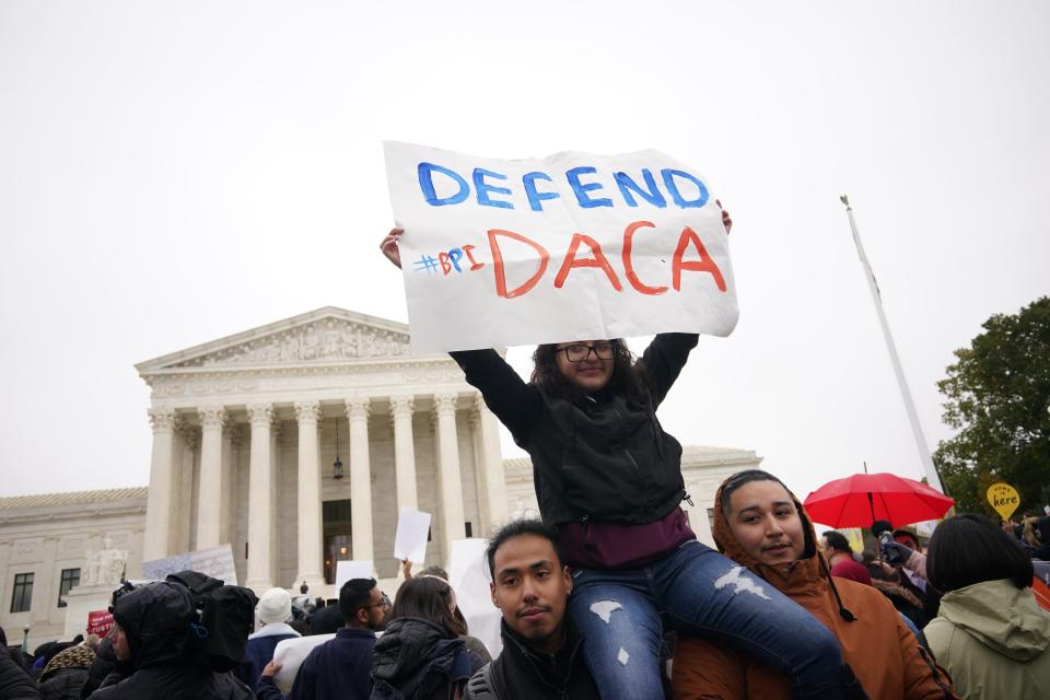 Immigration rights activists take part in a rally in front of the US Supreme Court in Washington, DC on November 12, 2019. - The US Supreme Court hears arguments on November 12, 2019 on the fate of the "Dreamers," an estimated 700,000 people brought to the country illegally as children but allowed to stay and work under a program created by former president Barack Obama.Known as Deferred Action for Childhood Arrivals or DACA, the program came under attack from President Donald Trump who wants it terminated, and expired last year after the Congress failed to come up with a replacement. (Photo by MANDEL NGAN / AFP) (Photo by MANDEL NGAN/AFP via Getty Images) ORIG FILE ID: AFP_1M776J