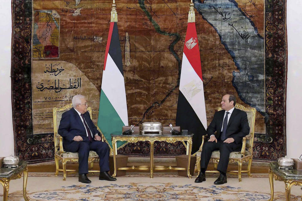 In this photo provided by Egypt's presidency media office, Egyptian President Abdel-Fattah el-Sissi, right, meets with Palestinian President Mahmoud Abbas at the Presidential Palace in Cairo, Egypt, Monday Jan. 8, 2024. Monday’s talks between Abbas and el-Sissi focused on Israel’s ongoing military operations in Gaza and the surging violence in the Israeli-occupied West Bank, according to a statement released by Egypt’s presidential office. (Egyptian Presidency Media Office via AP)