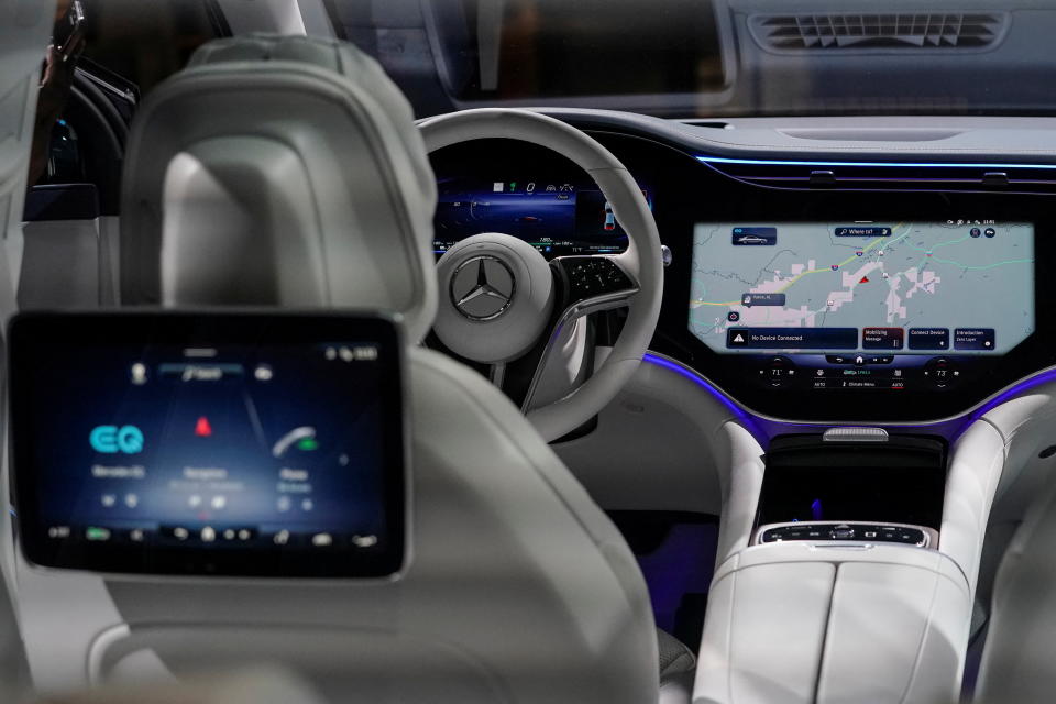 An optional rear-seat screen and two of the three front digital dashboard screens are seen in the new all-electric EQS SUV during a tour at the opening of a Mercedes-Benz electric vehicle Battery Factory, marking one of only seven locations producing batteries for their fully electric Mercedes-EQ models, in Woodstock, Alabama, U.S., March 15, 2022. REUTERS/Elijah Nouvelage