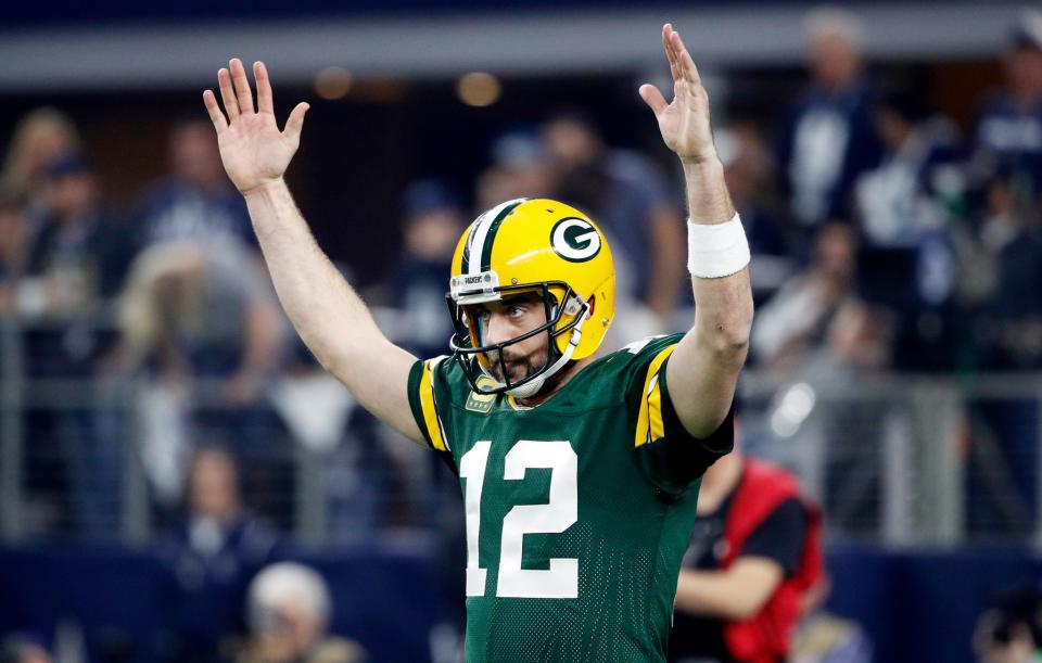 Aaron Rodgers #12 of the Green Bay Packers reacts after scoring a touchdown in the first half during the NFC Divisional Playoff Game against the Dallas Cowboys at AT&T Stadium on January 15, 2017 in Arlington, Texas. (Photo by Joe Robbins/Getty Images)