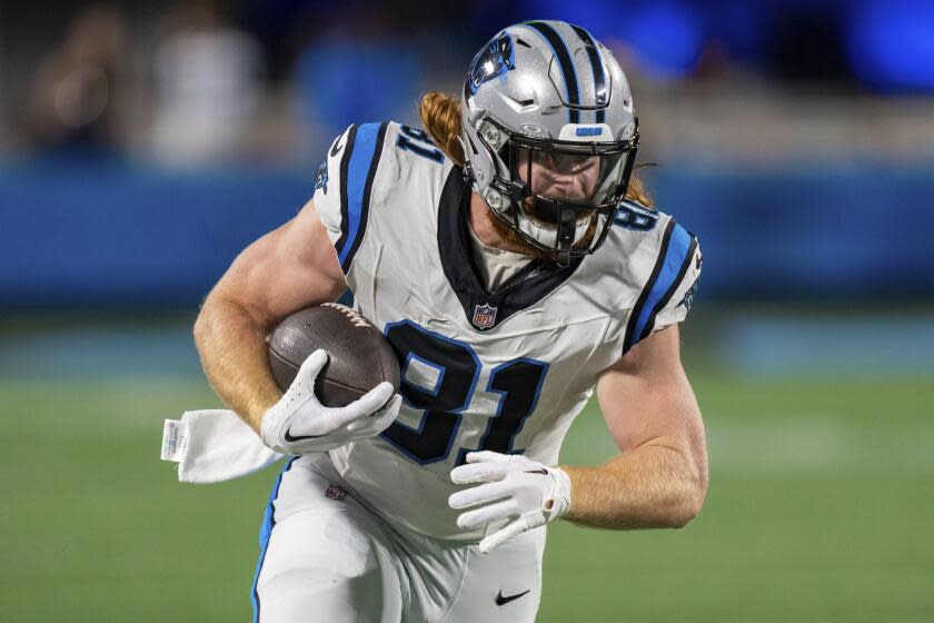 Carolina Panthers tight end Hayden Hurst (81) runs after a catch against the New Orleans Saints.