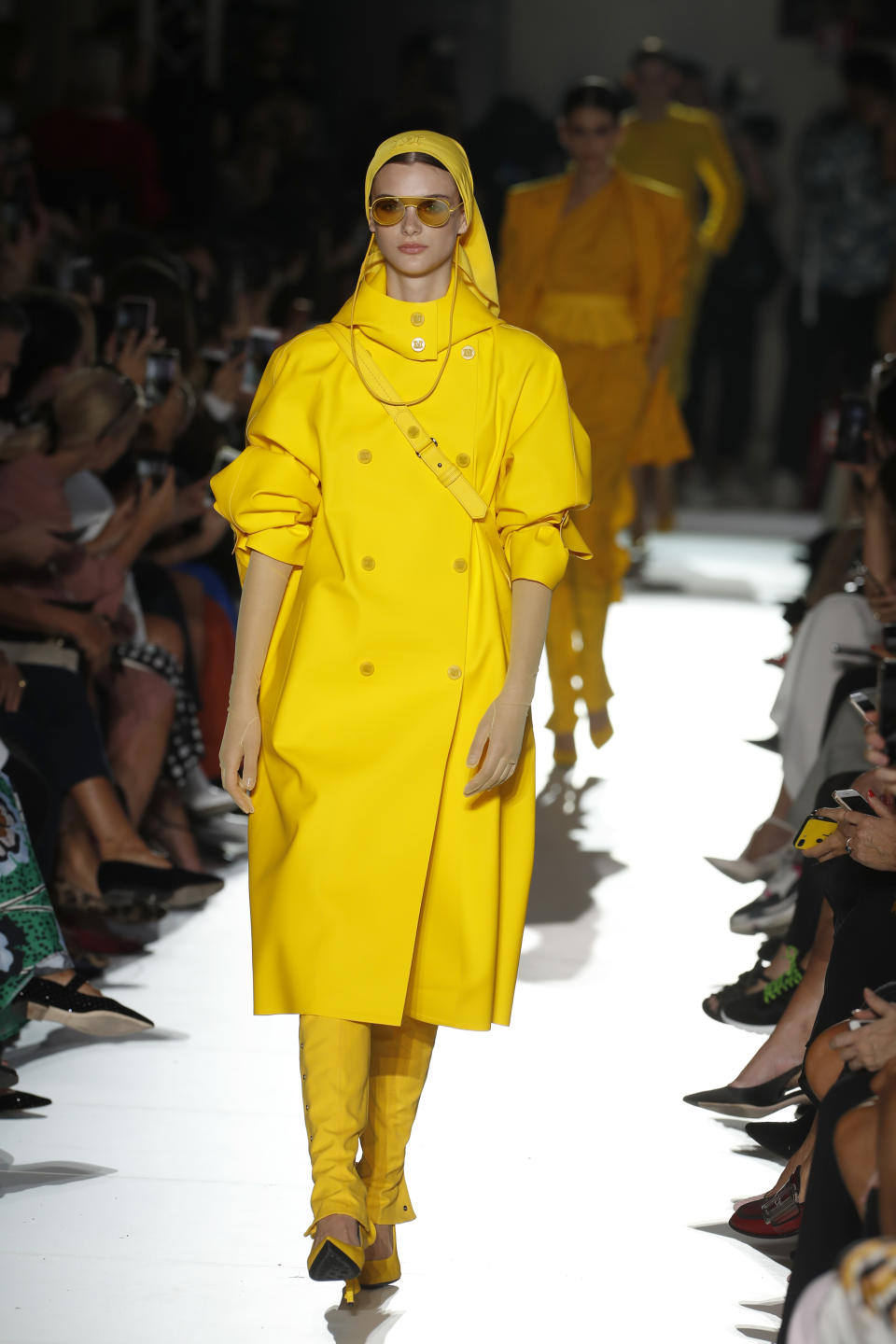 A model wears a creation as part of the Max Mara women's 2019 Spring-Summer collection, unveiled during the Fashion Week in Milan, Italy, Thursday, Sept. 20, 2018. (AP Photo/Antonio Calanni)