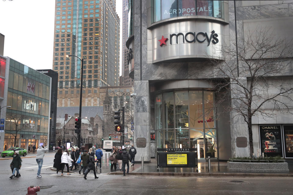 CHICAGO, ILLINOIS - NOVEMBER 21: Pedestrians walk past a Macy's store downtown on November 21, 2019 in Chicago, Illinois. Macy’s Inc. reported a drop in third quarter sales and said the company is anticipating a weak holiday quarter as they, like other department stores, struggle to continue to attract customers. (Photo by Scott Olson/Getty Images)