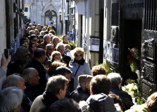 People line to visit the Duarte's Family vault where rest the remains of Eva Duarte de Peron on the 60th anniversary of her death in Buenos Aires. Argentinians, including President Cristina Kirchner, pay tribute to Eva Peron Thursday on the 60th anniversary of the national icon's premature death