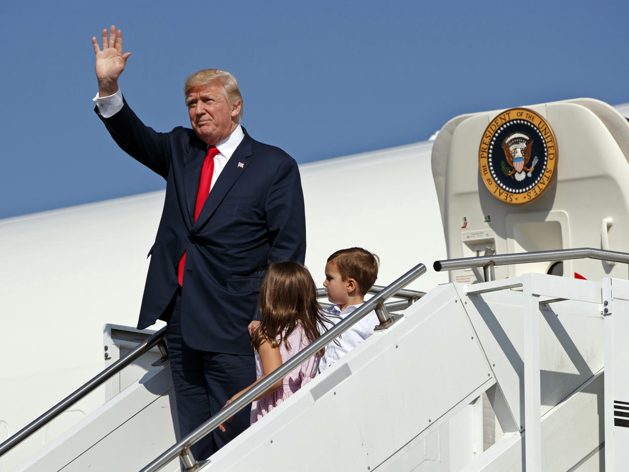 President Donald Trump waves as he walks down the steps of Air Force One: AP