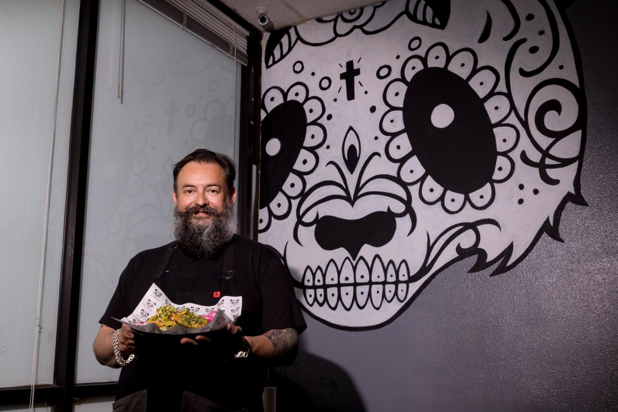 Chef Rulis holds a plate of chicken chicharron tacos that are prepared at the Asian-inspired Taqueria, Chin-Gon-Chow, on Thursday, June 20, 2024. The restaurant will open on Taco Tuesday, June 25, at 11360 Montwood Dr. in East El Paso.