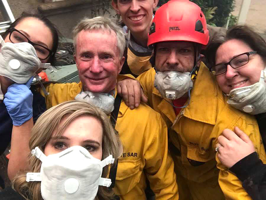 Tamara Ferguson (bottom left) with coworkers and firefighters after rescue from fire at Feather River Hospital