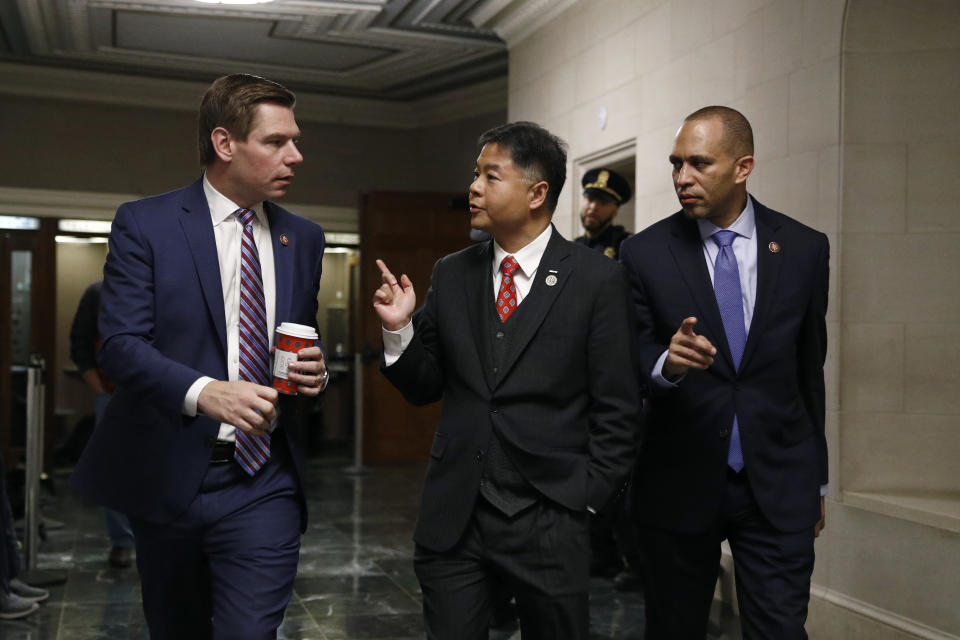 Rep. Eric Swalwell, D-Calif., left, walks outside a hearing room with Rep. Ted Lieu, D-Calif., center, and Rep. Hakeem Jeffries, D-N.Y., as the House Judiciary Committee hears investigative findings in the impeachment inquiry of President Donald Trump, Monday, Dec. 9, 2019, on Capitol Hill in Washington. (AP Photo/Patrick Semansky)