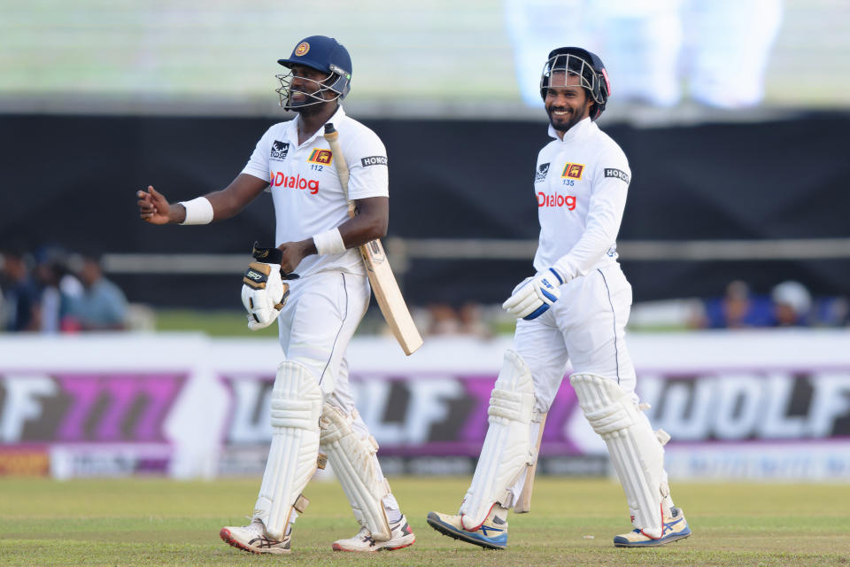 Sri Lanka's Angelo Mathews and captain Dhananjaya de Silva leave the ground at the end of the third day of the first cricket test match between New Zealand and Sri Lanka in Galle, Sri Lanka, Friday, Sept. 20, 2024. (AP Photo/Viraj Kothalawala)