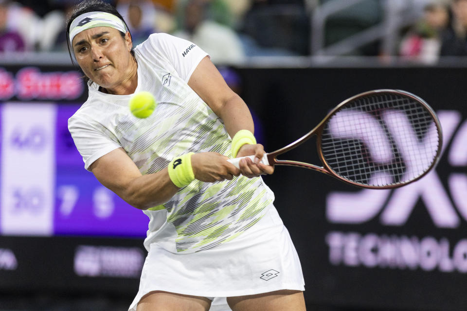 Ons Jabeur, of Tunisia, returns a shot to Daria Kasatkina, of Russia, during a semifinal match at the Charleston Open tennis tournament in Charleston, S.C., Saturday, April 8, 2023. (AP Photo/Mic Smith)