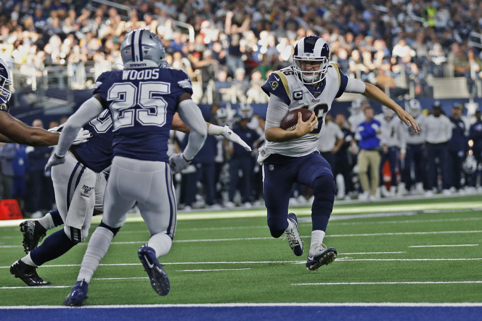 Los Angeles Rams quarterback Jared Goff (16) is about to be stopped short of the goal line by Dallas Cowboys outside linebacker Sean Lee, left, as Cowboys' Xavier Woods (25) moves in during the first half of an NFL football game in Arlington, Texas, Sunday, Dec. 15, 2019. (AP Photo/Roger Steinman)