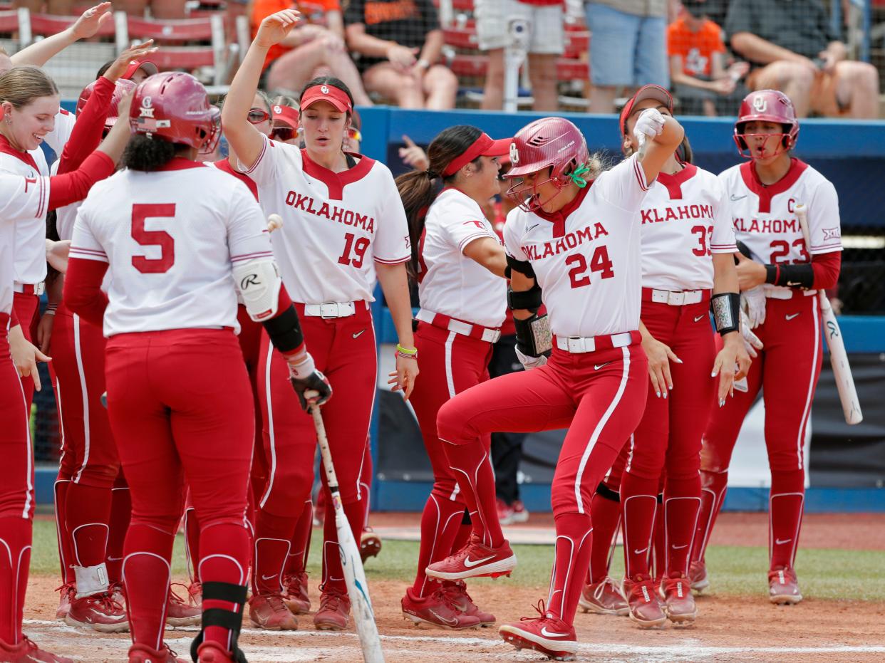 OU outfielder Jayda Coleman (24) steps on home after hitting a home run in the second inning of a 10-1 win against Kansas in the Big 12 softball tournament quarterfinals Thursday at Devon Park.