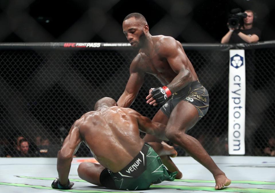Leon Edwards (right) in his trilogy bout with Kamaru Usman in March (PA)