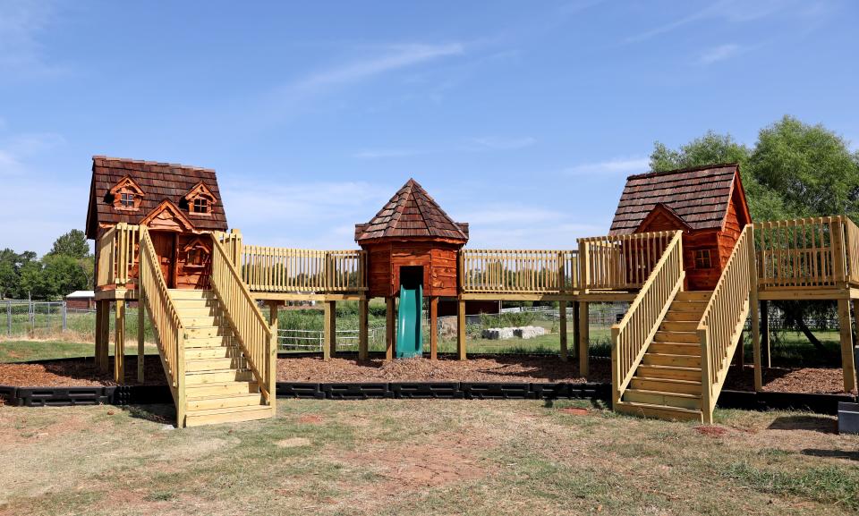 One of the new attractions this year at Orr Family Farm is a kid's playground built from a stained wood.