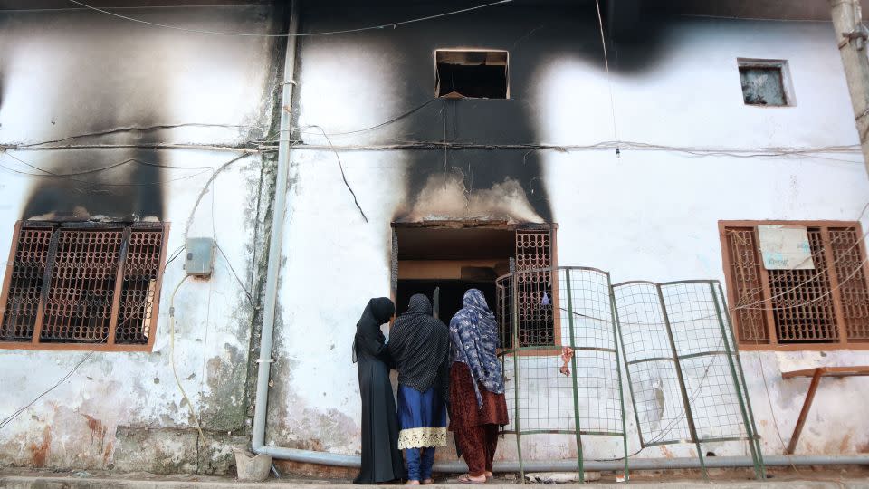 Muslims look inside a charred mosque after it was set on fire by a mob during riots in the Mustafabad area of New Delhi on February 29, 2020. - Muzamil Mattoo/NurPhoto/Getty Images/File