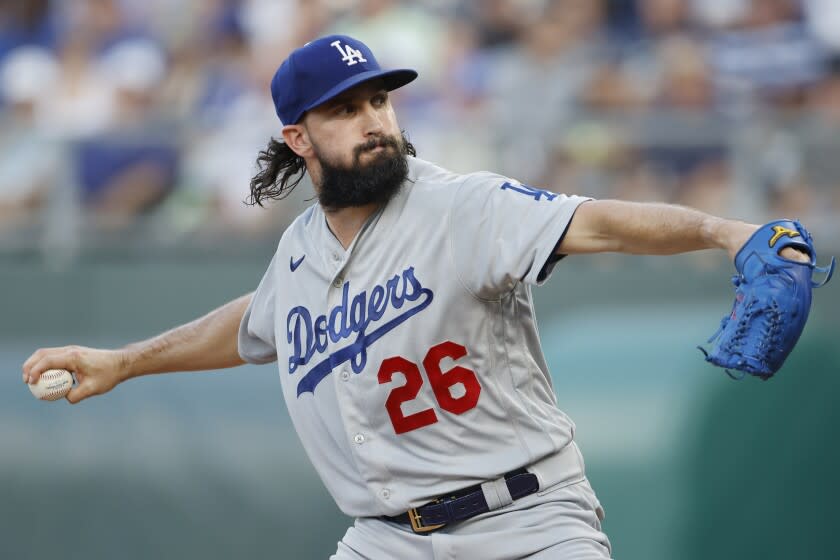 Los Angeles Dodgers pitcher Tony Gonsolin throws to a Kansas City Royals.