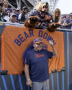 FILE - Former Chicago Bears linebacker Dick Butkus poses with fans during the team's NFL football game against the Green Bay Packers on Sept. 10, 2023, in Chicago. Butkus, a fearsome middle linebacker for the Bears, has died, the team announced Thursday, Oct. 5, 2023. He was 80. According to a statement released by the team, Butkus' family confirmed that he died in his sleep overnight at his home in Malibu, Calif. (AP Photo/Nam Y. Huh, File)