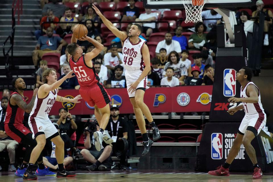 Fletcher Magee of the Houston Rockets attempts a shot against Cleveland Cavaliers forward Pete Nance (48) during the NBA summer league championship game July 17 in Las Vegas.