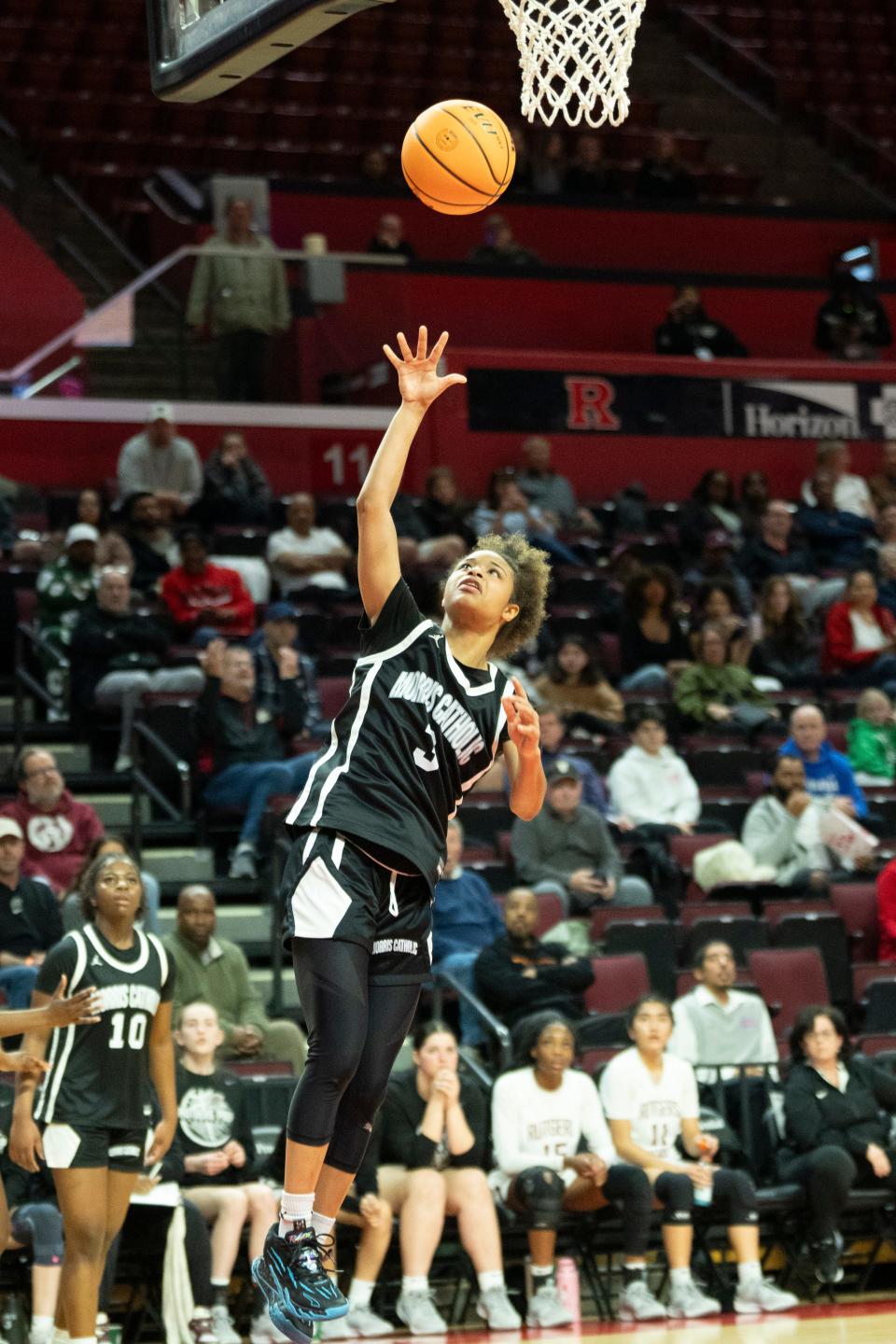 Mar 8, 2024; Piscataway, NJ, USA; Morris Catholic vs. Rutgers Prep in the NJSIAA Non-Public B Girls Basketball Final at Rutgers Athletic Center. MC #3 Mia Pauldo takes a shot.