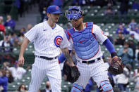 Chicago Cubs catcher Willson Contreras, right, congratulates starting pitcher Zach Davies after Davies got out of a no outs, base-loaded jam during the seventh inning of a baseball game against the Pittsburgh Pirates, Friday, May 7, 2021, in Chicago. (AP Photo/Charles Rex Arbogast)