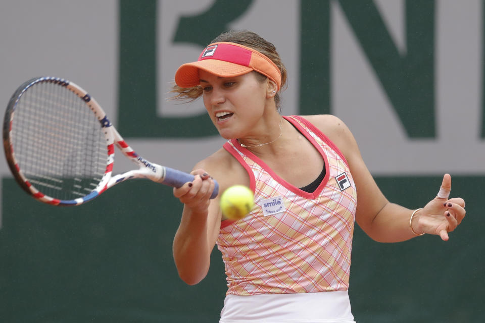 Sofia Kenin of the U.S. plays a shot against Russia's Liudmila Samsonova in the first round match of the French Open tennis tournament at the Roland Garros stadium in Paris, France, Tuesday, Sept. 29, 2020. (AP Photo/Christophe Ena)