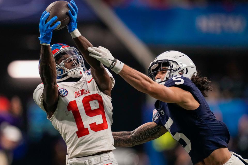 Dec 30, 2023; Atlanta, GA, USA; Mississippi Rebels wide receiver Dayton Wade (19) catches a pass behind Penn State Nittany Lions cornerback Cam Miller (5) during the first half at Mercedes-Benz Stadium. Mandatory Credit: Dale Zanine-USA TODAY Sports
