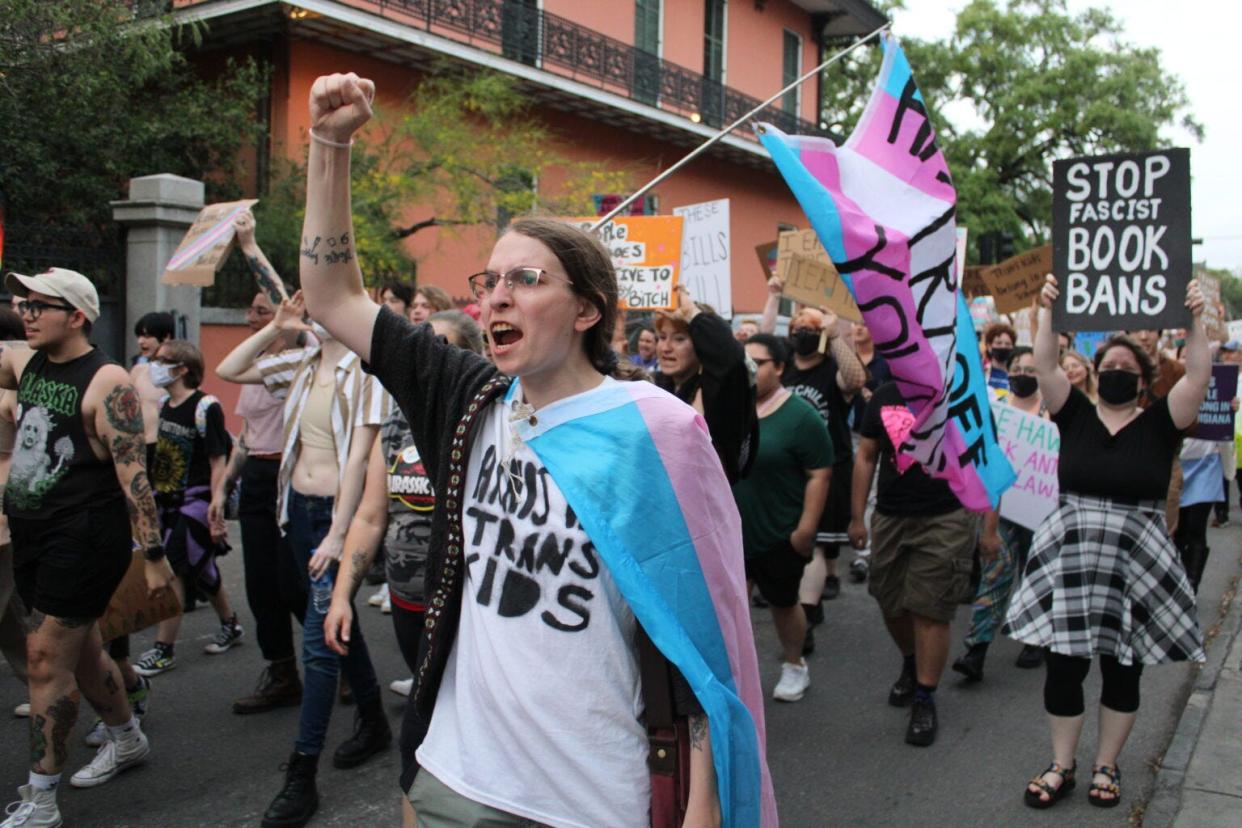Marchers walk through the French Quarter in New Orleans for Transgender Day of Visibility on Friday, March 31, 2023.