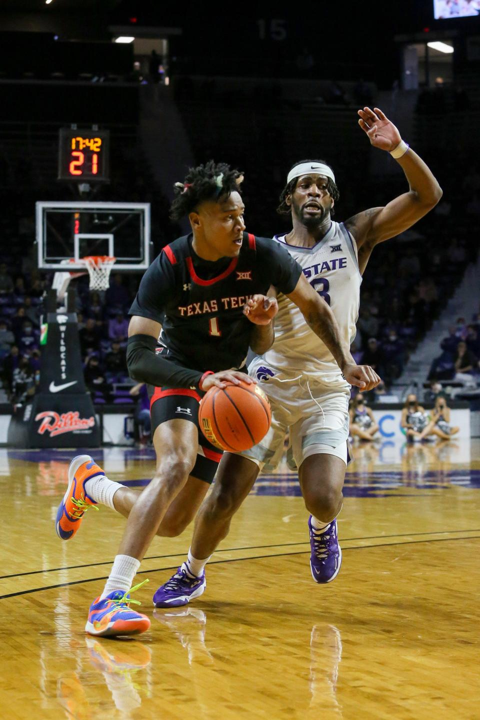 Texas Tech's Terrence Shannon, Jr. (1) dribbles against Kansas State's Selton Miguel (3) during a Big 12 Conference game Saturday at Bramlage Coliseum in Manhattan, Kansas.