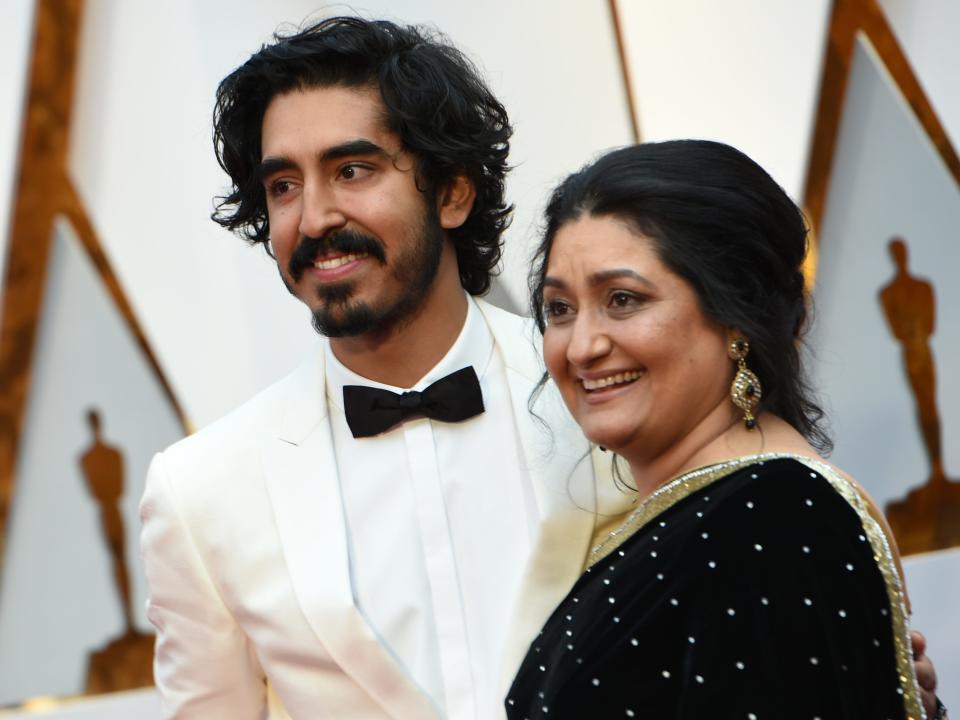 Dev Patel and his mother Anita at the 2017 Oscars on the red carpet together
