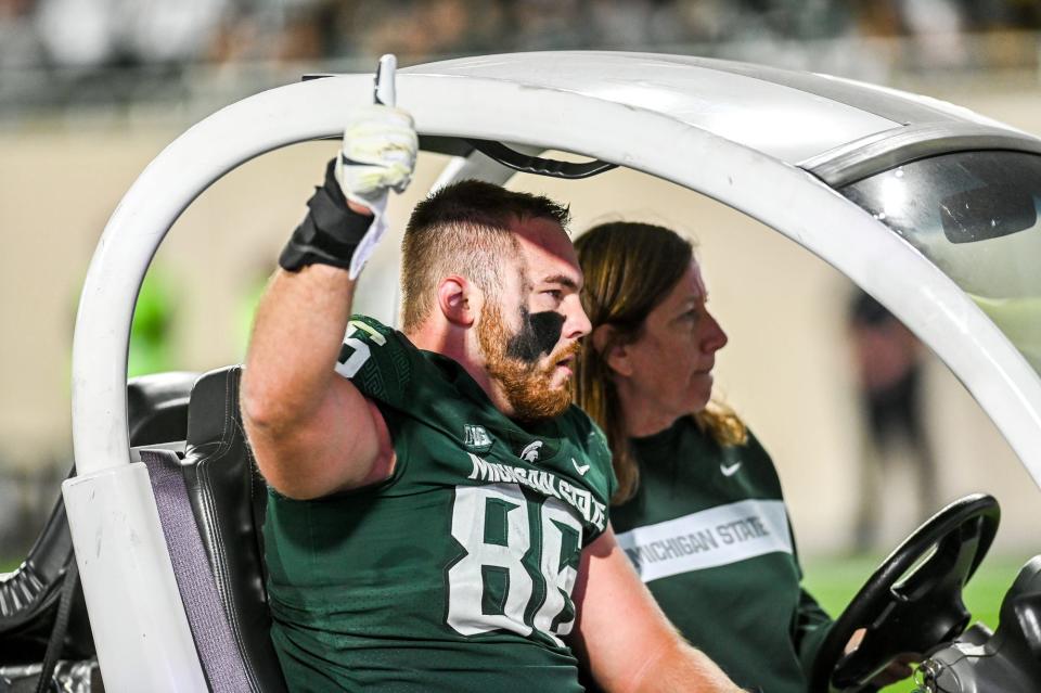 Michigan State's Drew Beesley gives the crowd a thumbs up after his injury against Nebraska during the second quarter on Saturday, Sept. 25, 2021, at Spartan Stadium in East Lansing.