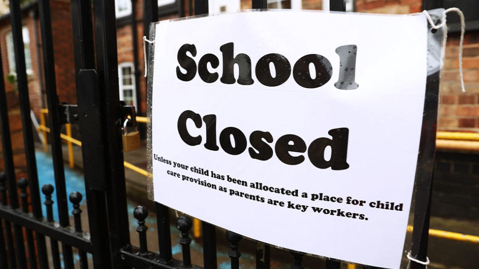 A sign is seen in front of a school announcing it is closed. Source: AAP