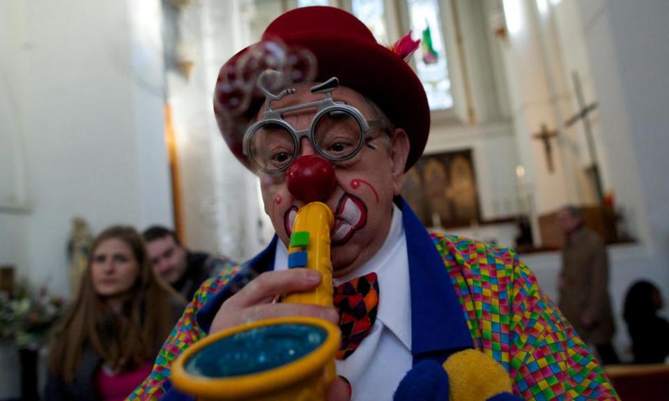 Clowns attend a service in memory of celebrated clown Joseph Grimaldi in Dalston, London