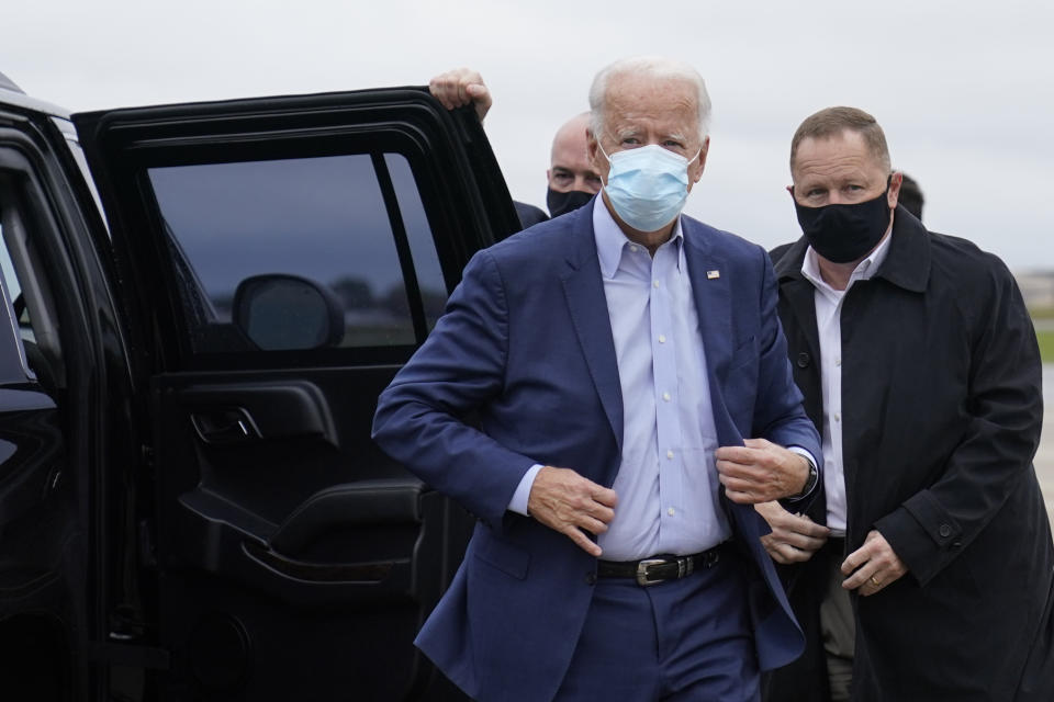 Democratic presidential candidate former Vice President Joe Biden exits his motorcade to board his campaign plane at New Castle Airport, in New Castle, Del., Monday, Oct. 12, 2020, en route to Ohio. (AP Photo/Carolyn Kaster)