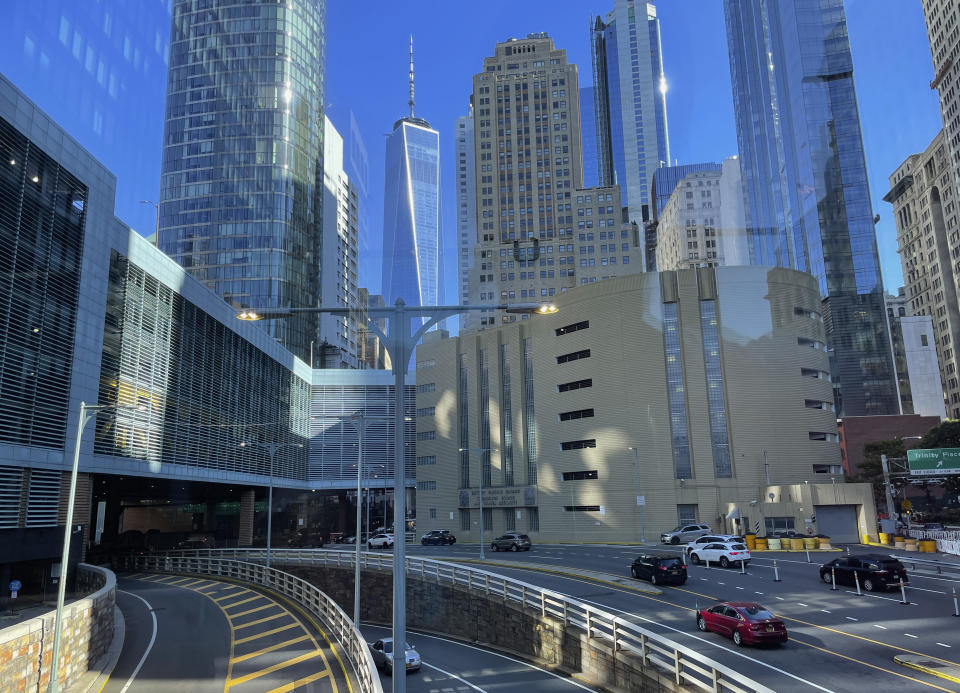 Morning sunlight is reflected off buildings in the financial district of lower Manhattan at the start of a work day on Wednesday, Sept. 14, 2022, in New York. (AP Photo/Wong Maye-E)