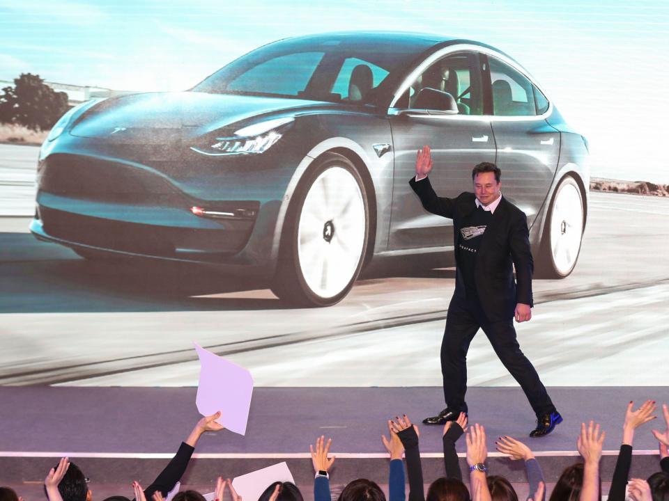 Tesla CEO Elon Musk gestures during the Tesla China-made Model 3 Delivery Ceremony in Shanghai on January 7, 2020 i