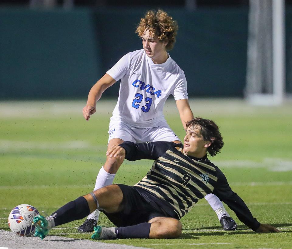 St. Vincent-St. Mary's Joey LaTrashe steals the ball from CVCA's Griffin Bosshard on Thursday, Sept. 21, 2022 in Akron.