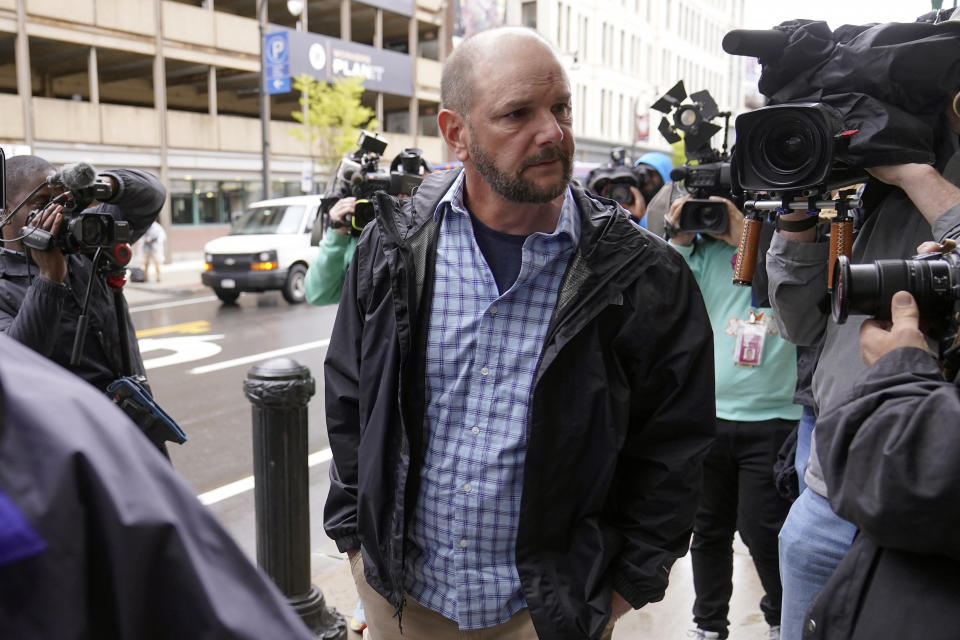 ADDS ID - Jack Michael Teixeira, center, father of Massachusetts Air National Guardsman Jack Teixeira arrives at federal court, Thursday, April 27, 2023, in Worcester, Mass. Jack Teixeira has been charged with leaking highly classified military documents. Teixeira has been charged under the Espionage Act with unauthorized retention and transmission of classified national defense information. (AP Photo/Steven Senne)