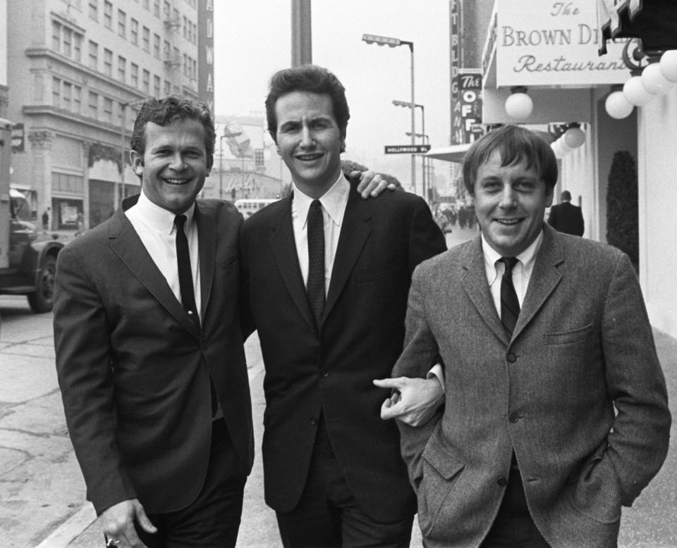 Bob Shane, left, poses with fellow Kingston Trio members John Stewart and Nick Reynolds in Los Angeles in 1967. Stewart joined the group after the departure of original member Dave Guard. Shane died Sunday at 85.